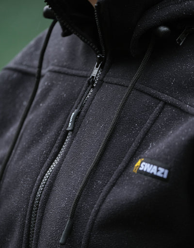 Swazi Amur Women’s Windbreaker Jacket with detachable hood, windproof fabric, and contoured fit for outdoor comfort.