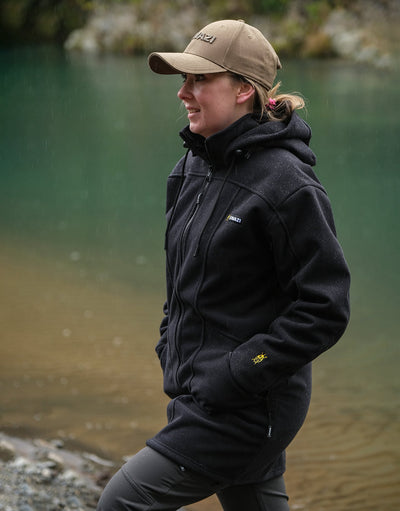 Swazi Amur Women’s Windbreaker Jacket with detachable hood, windproof fabric, and contoured fit for outdoor comfort.