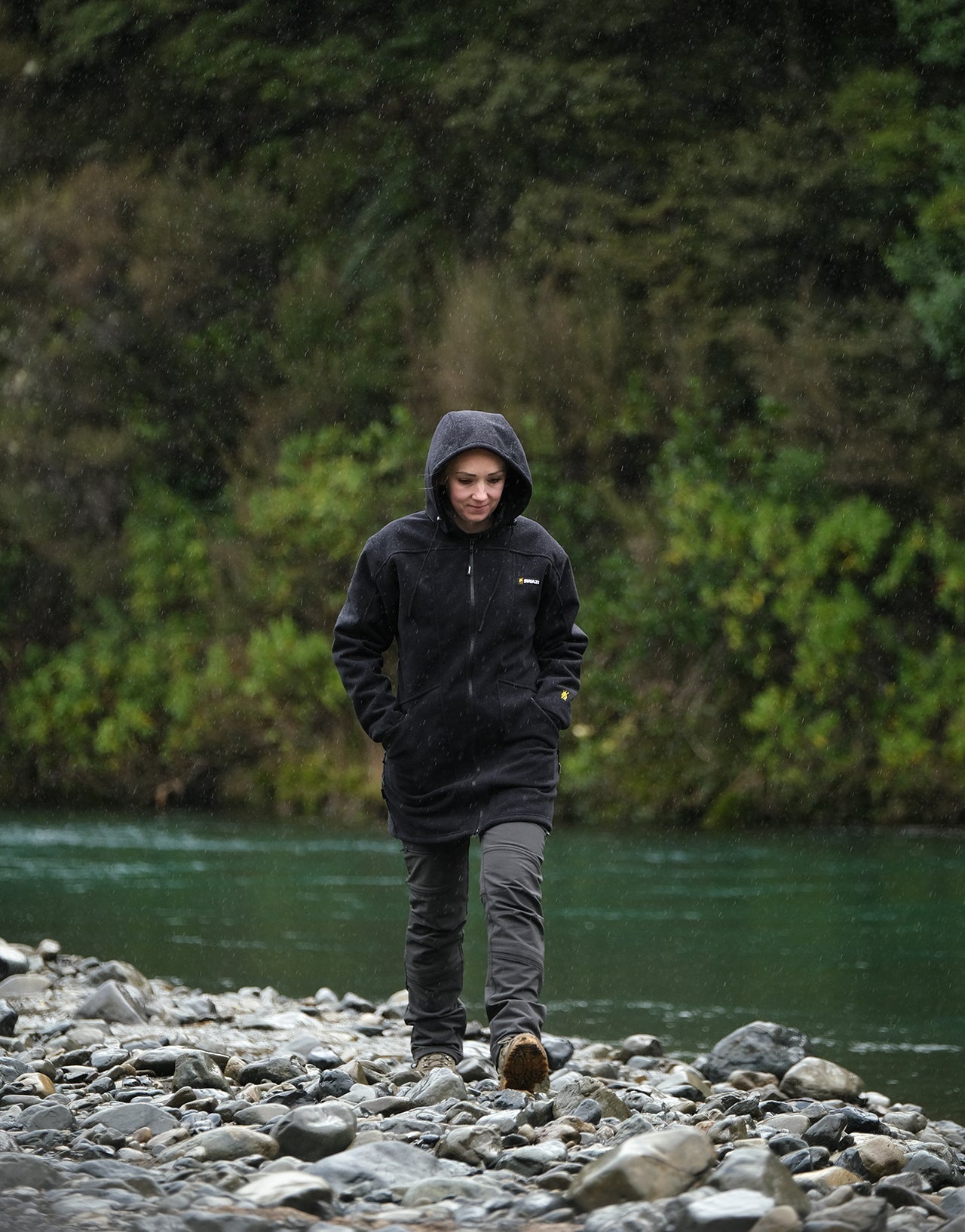 Swazi Amur Women’s Windbreaker Jacket with detachable hood, windproof fabric, and contoured fit for outdoor comfort.