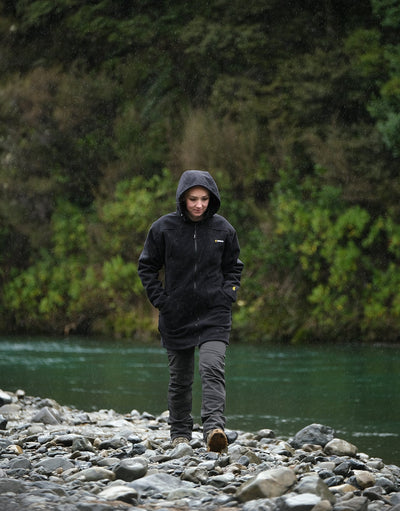 Swazi Amur Women’s Windbreaker Jacket with detachable hood, windproof fabric, and contoured fit for outdoor comfort.